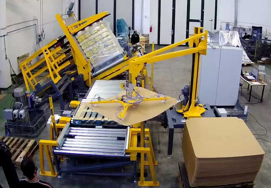 Automated slip sheet loading system in action